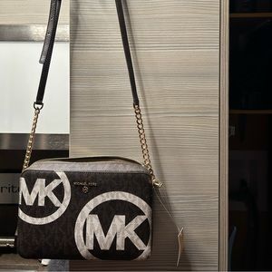 Michael Kors crossbody bag. Brand new with tags. Brown with white logo